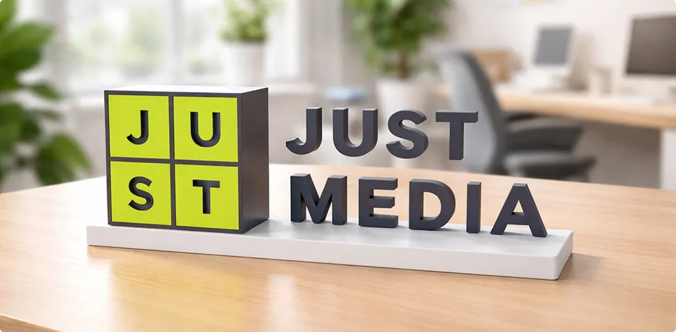 Just Media logo on the desk